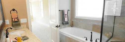 A bright bathroom featuring a large soaking tub, double sink vanity