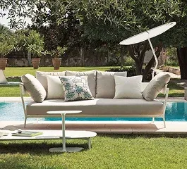A stylish outdoor sofa with decorative pillows