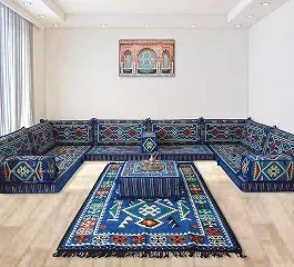 A vibrant Moroccan-style seating area with patterned blue cushions