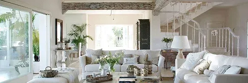 Bright and airy living room featuring a white sofa