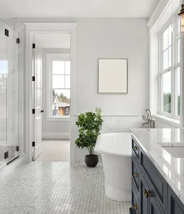 Bright, modern bathroom featuring a freestanding tub