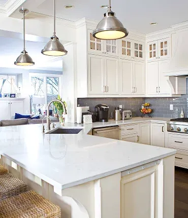 Bright, modern kitchen featuring white cabinetry