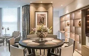 Elegant dining area featuring a round table, stylish chairs