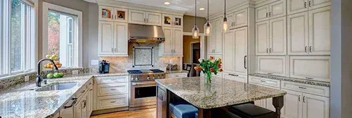 Modern kitchen featuring white cabinetry
