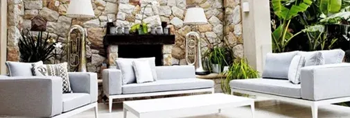 Modern outdoor living space featuring gray sofas