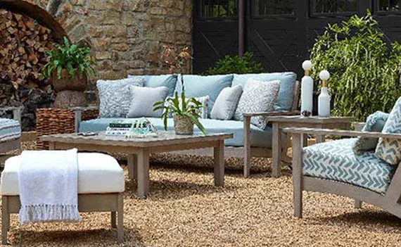 Stylish outdoor seating area with light blue cushions